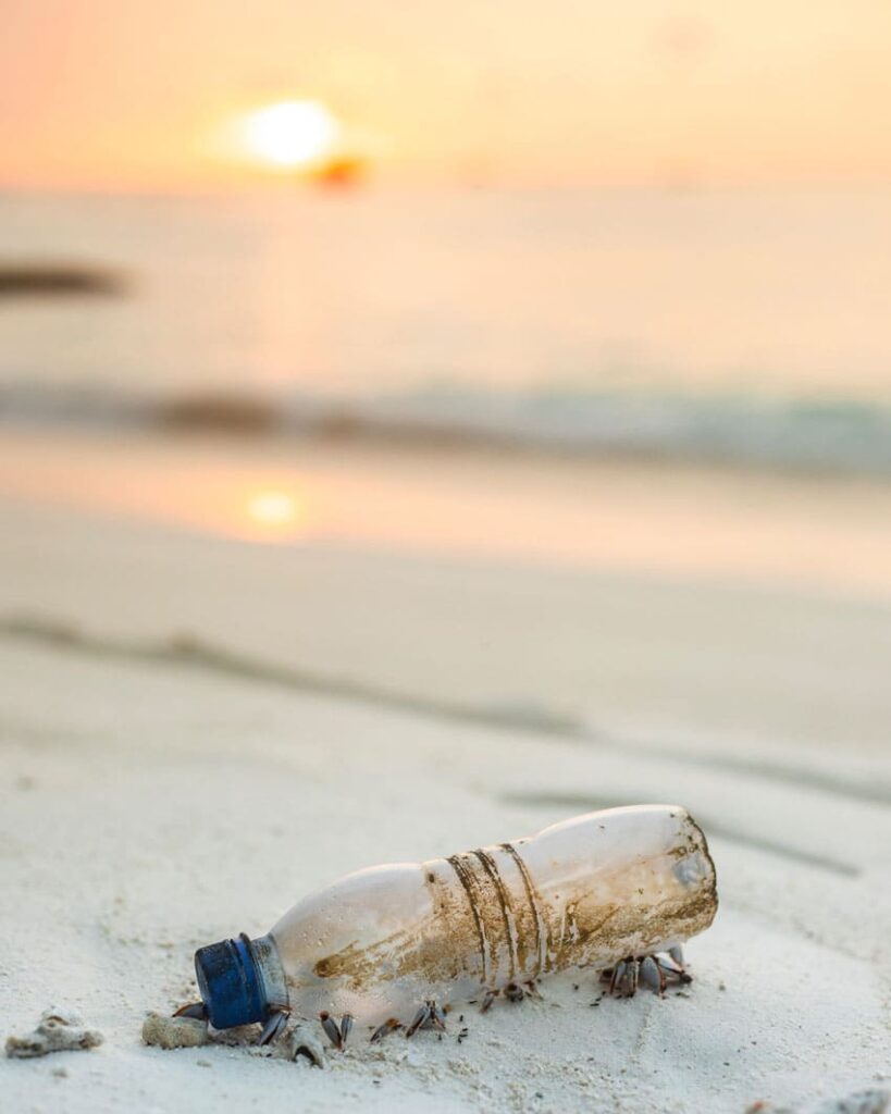 an-old-and-dirty-water-bottle-lying-in-the-sand