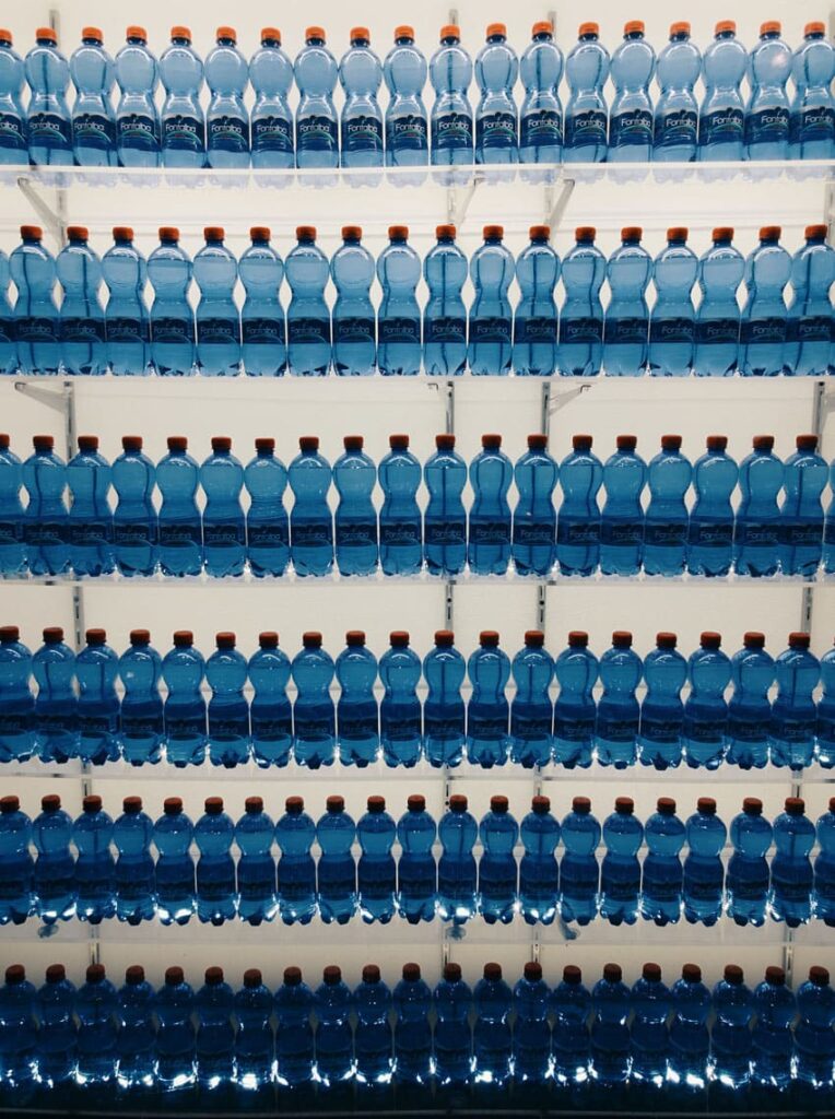lines-of-plastic-water-bottles-in-a-supermarket