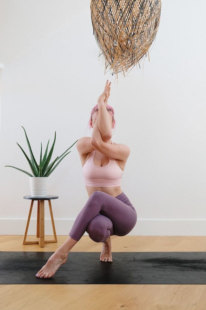 a young woman doing a yoga pose