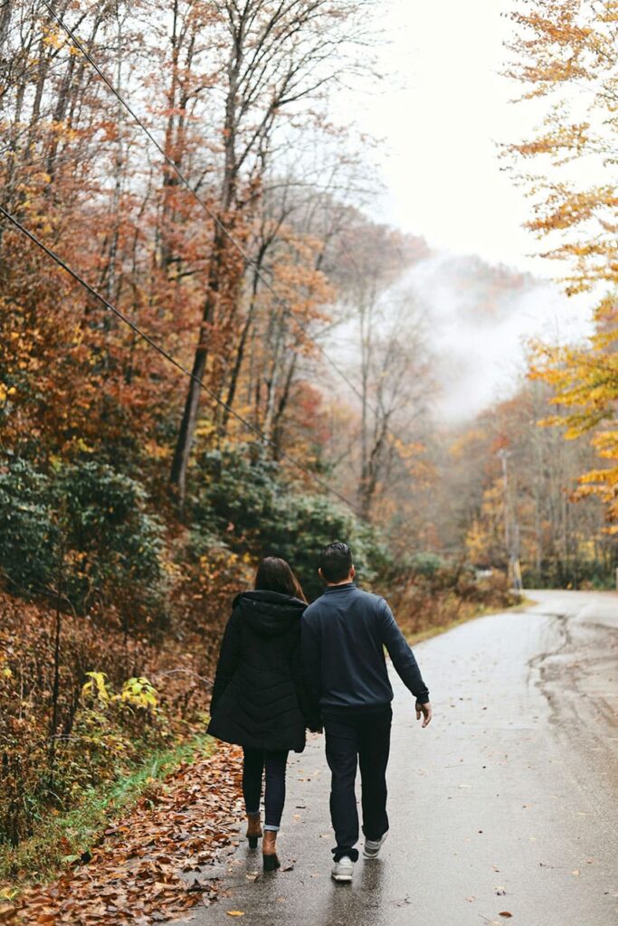 a couple walking on the streets duing fall - cheap fall activities for adults