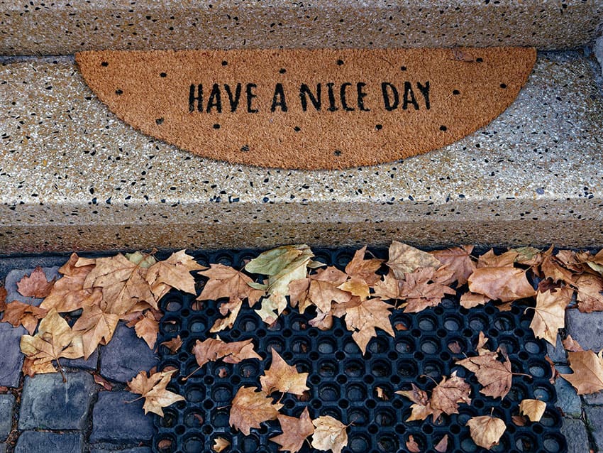 a cute doormat fall setting