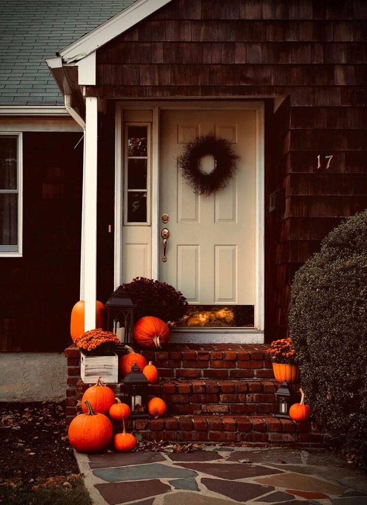 a porch decorated with pumpkins - cheap fall activities for adults