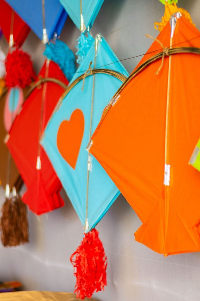 colorful kites hung on the wall