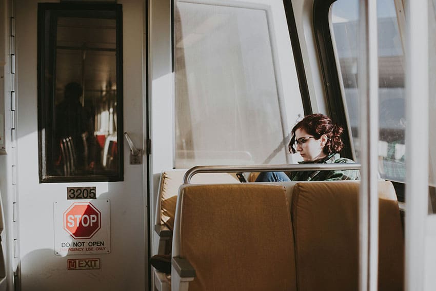 a woman on the train looking a bit sad