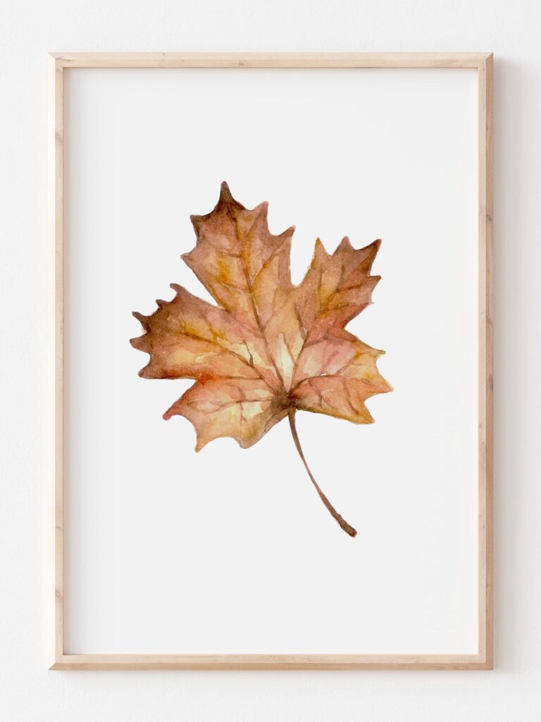 a print featuring a brown fall leaf with watercolor technique