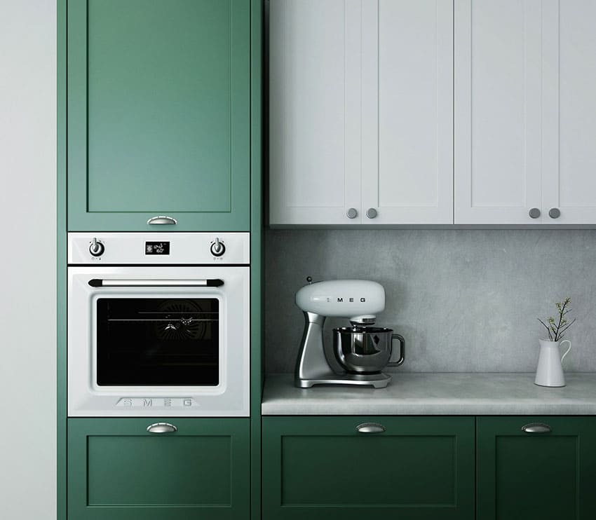 a kitchen with green cabinets