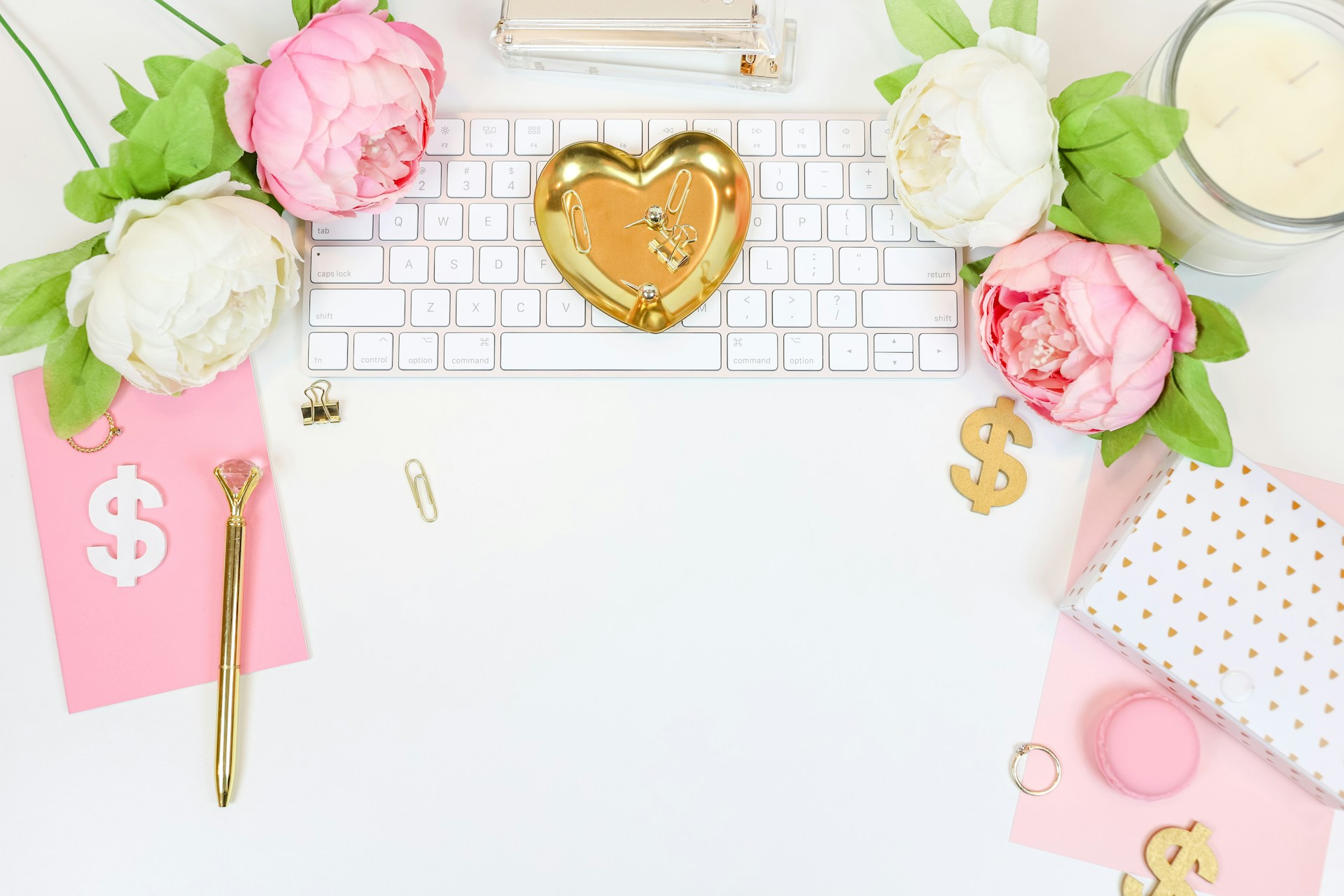 office desk with flowers and office supplies