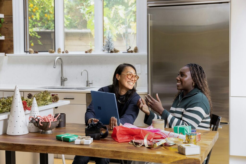 asian woman and Afro-American woman talking and laughing